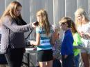 Becca Rubsamen, KJ6TWM, hold the mic as students at Rancho Romero Elementary School queue up to speak with astronaut Mike Hopkins, at NA1SS.