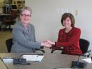 Craigie and McGovern shake hands after signing the new MoU. [Michael Halston, ARC, Photo]   